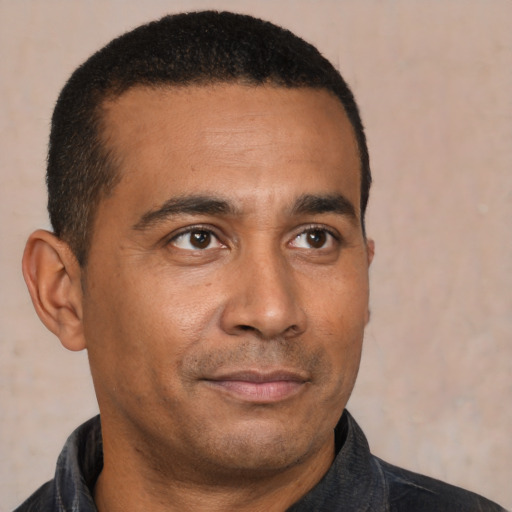 Neutral latino young-adult male with short  brown hair and brown eyes