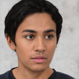 Neutral latino young-adult male with short  brown hair and brown eyes