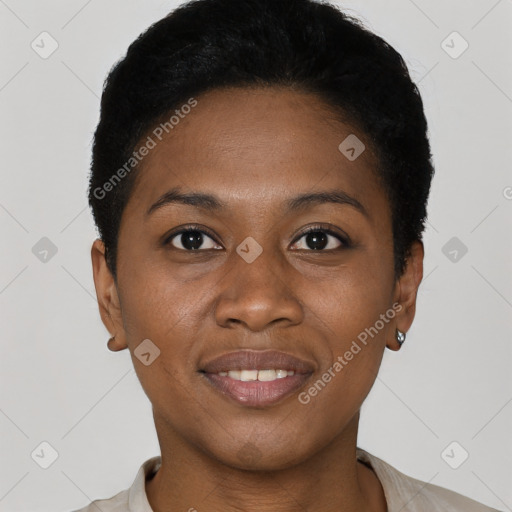 Joyful black young-adult female with short  black hair and brown eyes