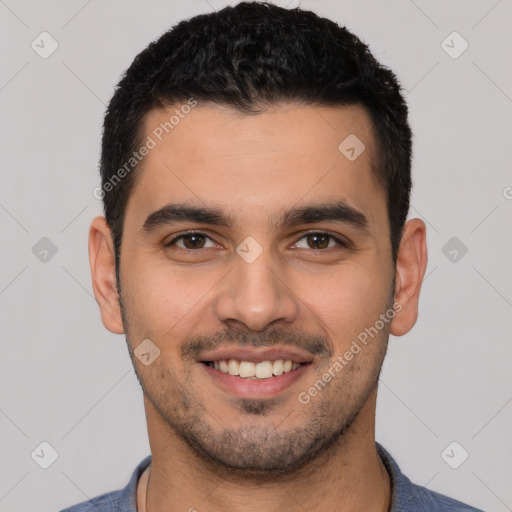 Joyful white young-adult male with short  black hair and brown eyes