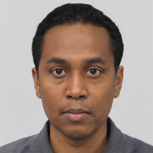 Neutral black young-adult male with short  black hair and brown eyes