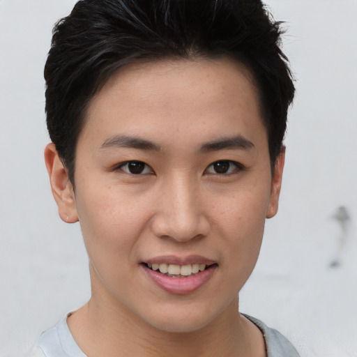 Joyful asian young-adult female with short  brown hair and brown eyes