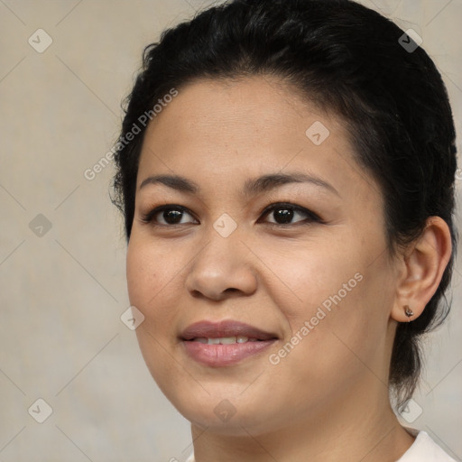 Joyful latino young-adult female with medium  brown hair and brown eyes