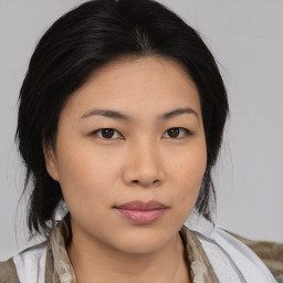 Neutral asian young-adult female with medium  brown hair and brown eyes