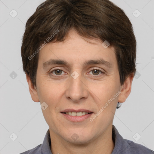 Joyful white adult male with short  brown hair and brown eyes