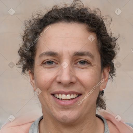 Joyful white adult female with short  brown hair and brown eyes