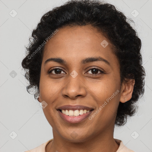 Joyful latino young-adult female with short  black hair and brown eyes