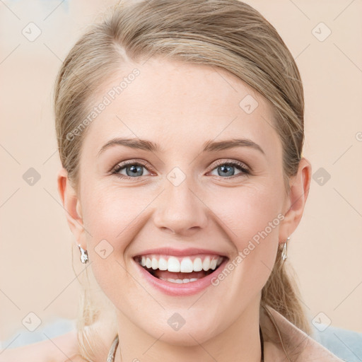 Joyful white young-adult female with medium  brown hair and blue eyes