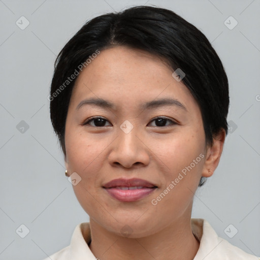 Joyful asian young-adult female with short  black hair and brown eyes