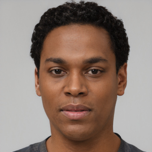 Neutral black young-adult male with short  black hair and brown eyes