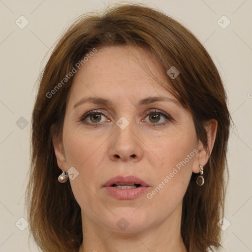 Joyful white adult female with medium  brown hair and brown eyes