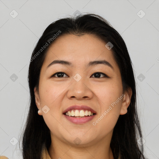 Joyful asian young-adult female with long  brown hair and brown eyes