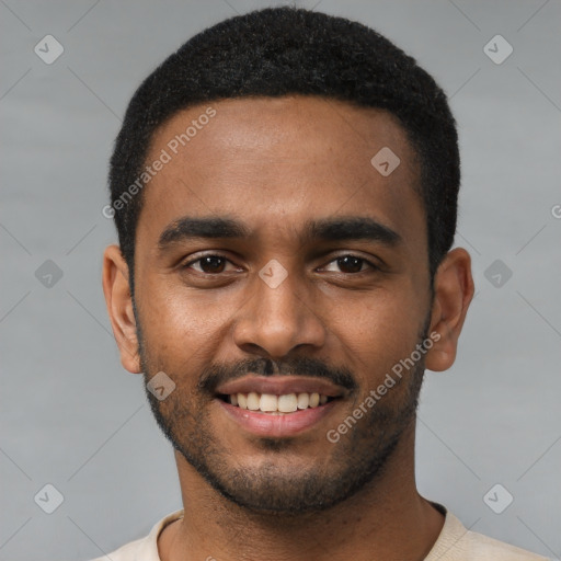 Joyful black young-adult male with short  black hair and brown eyes