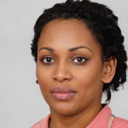 Neutral black young-adult female with medium  black hair and brown eyes