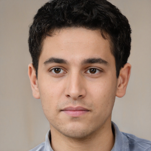 Neutral white young-adult male with short  black hair and brown eyes