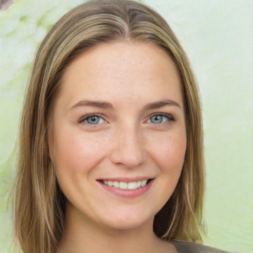 Joyful white young-adult female with long  brown hair and green eyes