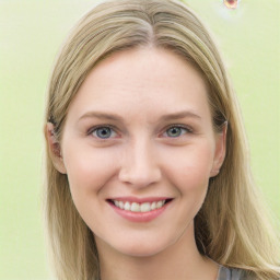 Joyful white young-adult female with long  brown hair and blue eyes