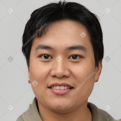 Joyful asian young-adult male with short  brown hair and brown eyes