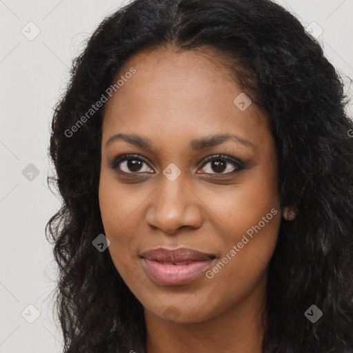 Joyful black young-adult female with long  brown hair and brown eyes