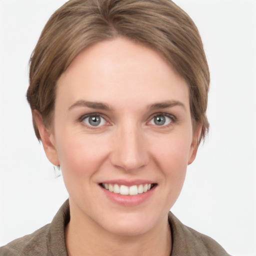 Joyful white young-adult female with short  brown hair and grey eyes