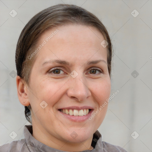 Joyful white adult female with short  brown hair and brown eyes