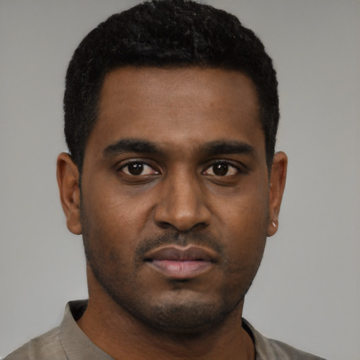 Neutral black young-adult male with short  black hair and brown eyes