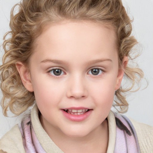 Joyful white child female with medium  brown hair and blue eyes