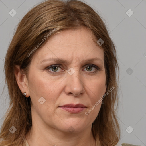 Joyful white adult female with medium  brown hair and grey eyes