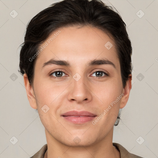 Joyful white young-adult female with short  brown hair and brown eyes