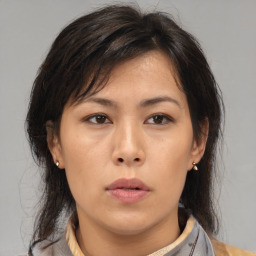 Neutral asian young-adult female with medium  brown hair and brown eyes