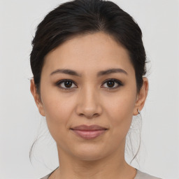 Joyful asian young-adult female with medium  brown hair and brown eyes