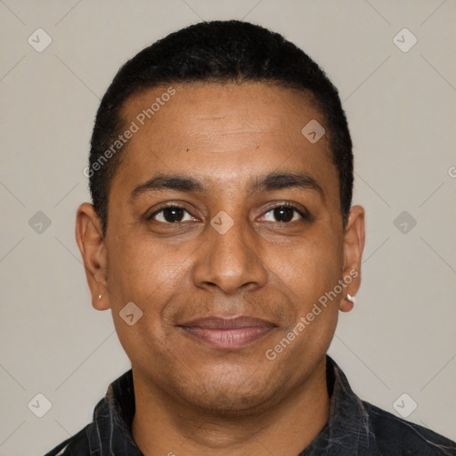 Joyful latino adult male with short  black hair and brown eyes