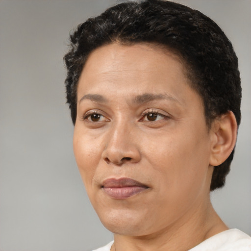 Joyful white adult female with short  brown hair and brown eyes