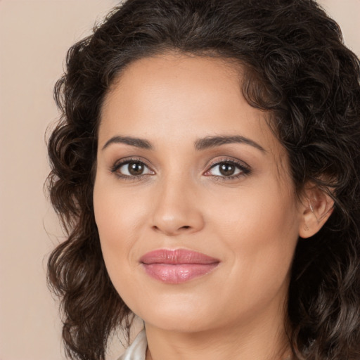 Joyful white young-adult female with long  brown hair and brown eyes