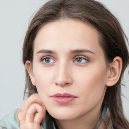 Neutral white young-adult female with long  brown hair and grey eyes