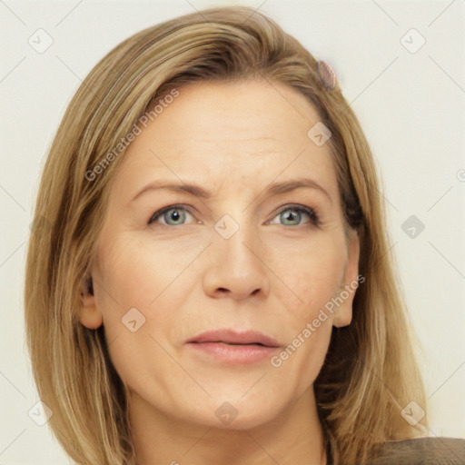 Joyful white adult female with long  brown hair and blue eyes