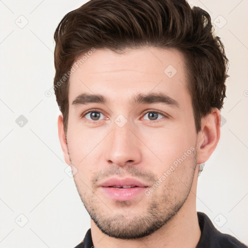 Neutral white young-adult male with short  brown hair and brown eyes