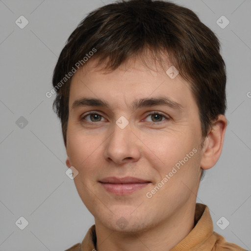 Joyful white young-adult male with short  brown hair and brown eyes