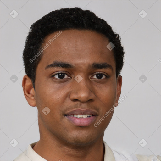 Joyful black young-adult male with short  brown hair and brown eyes