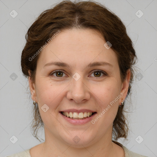 Joyful white young-adult female with medium  brown hair and green eyes