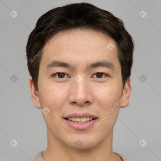 Joyful asian young-adult male with short  brown hair and brown eyes