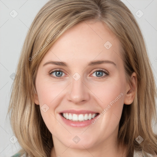 Joyful white young-adult female with medium  brown hair and blue eyes