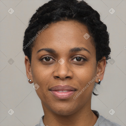 Joyful black young-adult female with short  black hair and brown eyes