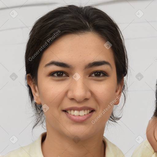 Joyful latino young-adult female with medium  brown hair and brown eyes