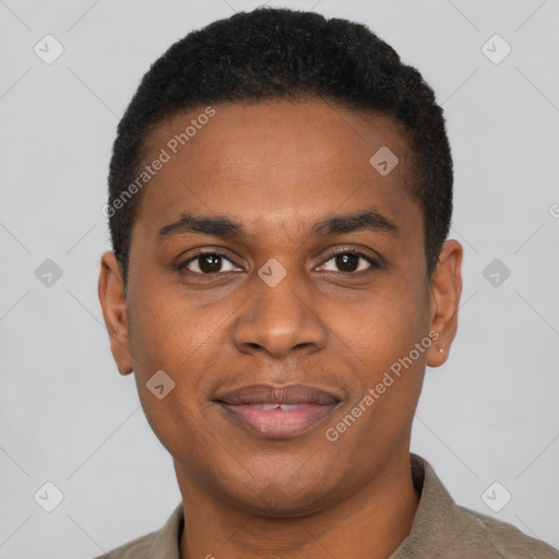 Joyful black young-adult male with short  black hair and brown eyes