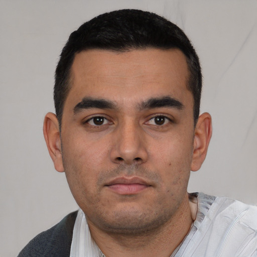 Neutral white young-adult male with short  black hair and brown eyes