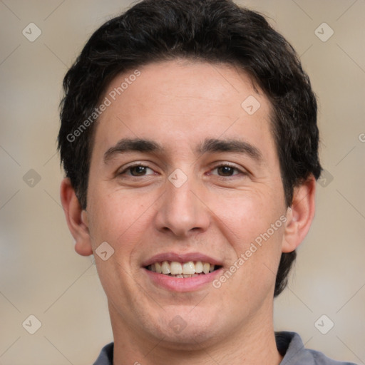 Joyful white young-adult male with short  black hair and brown eyes