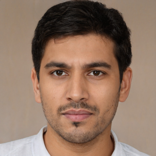 Neutral latino young-adult male with short  black hair and brown eyes