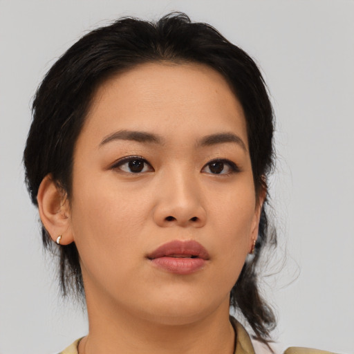 Neutral asian young-adult female with medium  brown hair and brown eyes