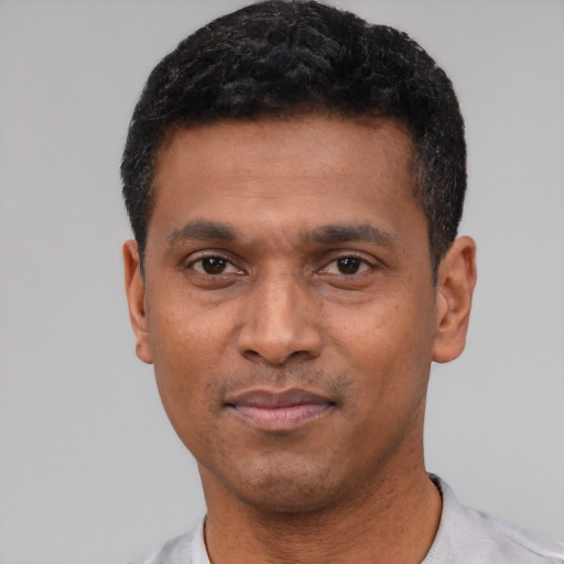 Neutral latino adult male with short  black hair and brown eyes